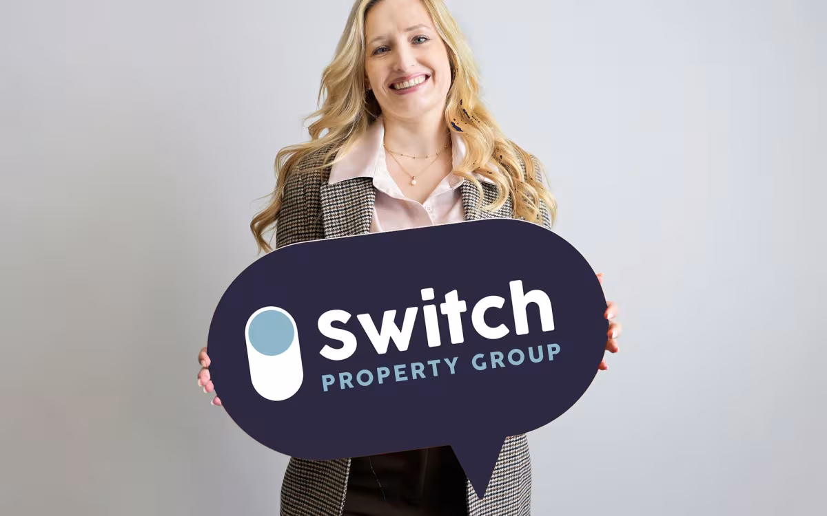 Branded estate agent sign used for property marketing and agency branding